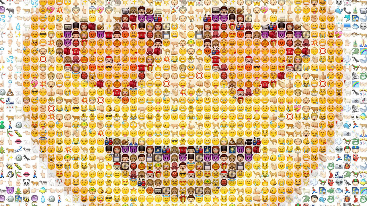 Image of a smiley face emoji made up of several Apple emojis