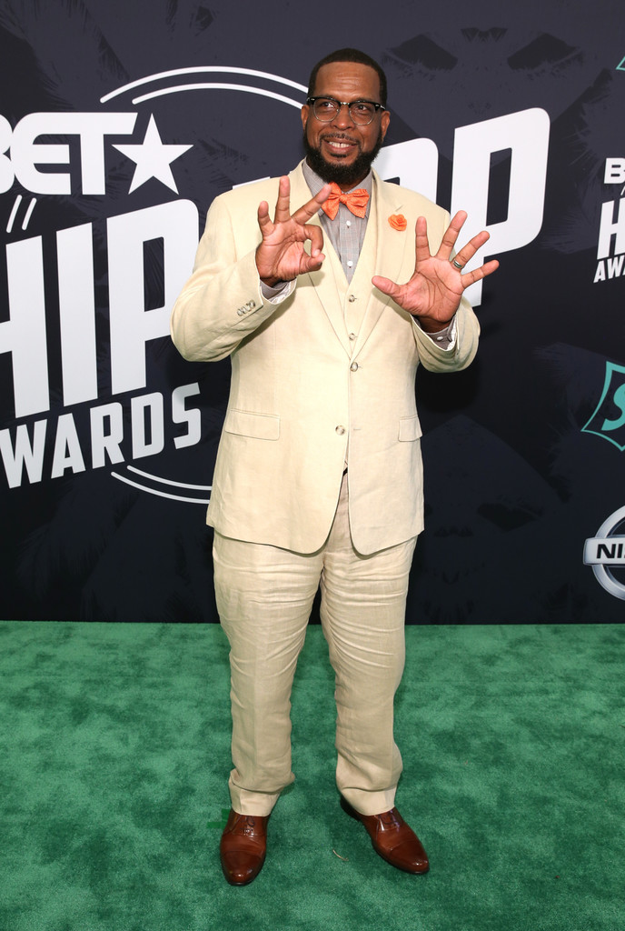 Luke Campbell standing on the green carpet at the bet hip hop awards
