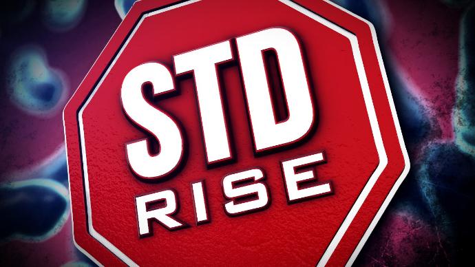 STD Rise printed on stop sign
