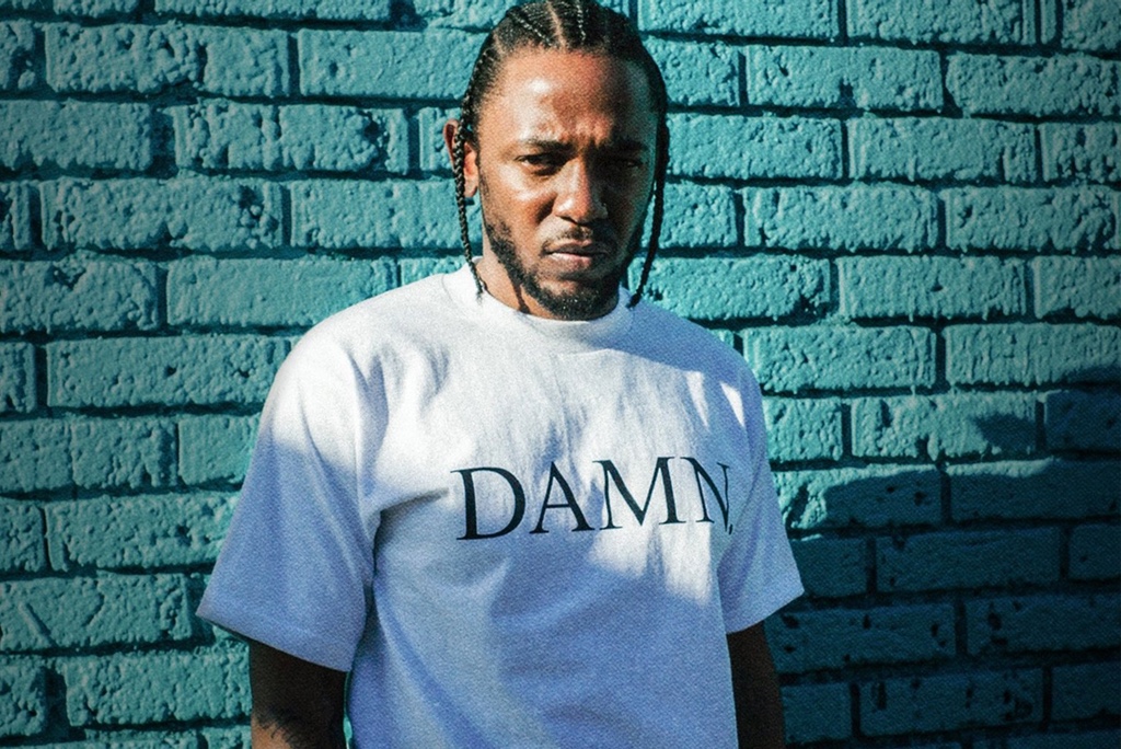 Rapper Kendrick Lamar wearing a white tshirt with the word Damn